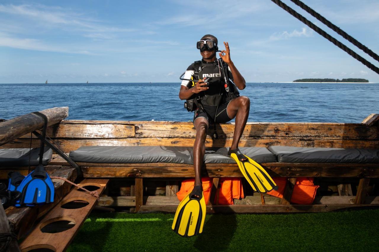The Mora Zanzibar Hotel Matemwe  Exterior photo Scuba diver with a pair of open heel fins