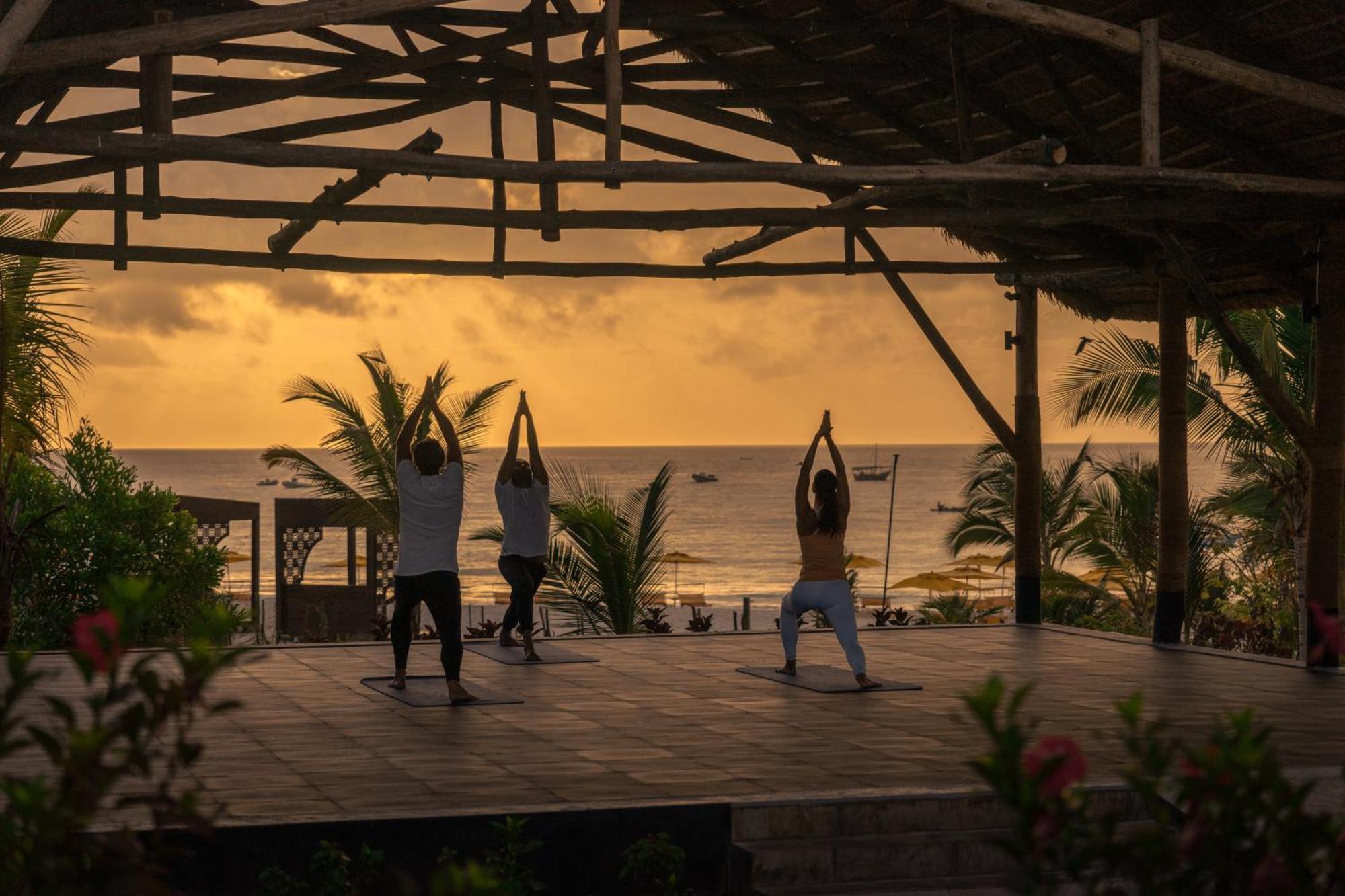 The Mora Zanzibar Hotel Matemwe  Exterior photo Sunset yoga at the beach